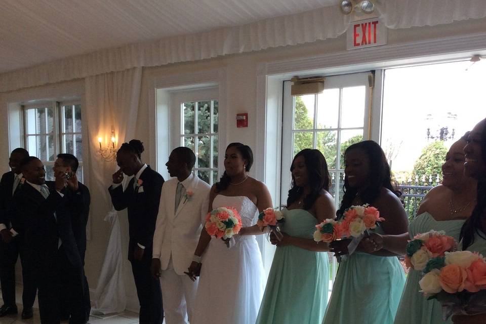 The couple with the bridesmaids and groomsmen