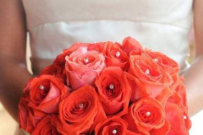 Brides bouquet by Sweet Bliss Events. Salmon colored roses with rhinestones.