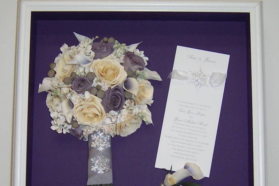 The dark background for this bouquet preservation shows off the delicate details of the flowers, bouquet wrap, and invitation. Stunning!