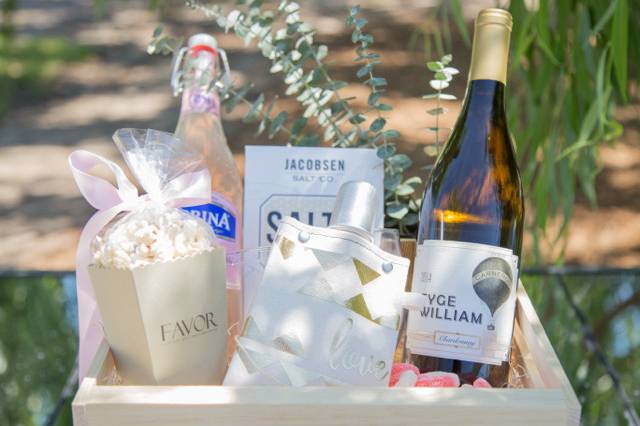 Gorgeous wedding welcome box created by Favor for The Barn at Tyge William Cellars in Sonoma, featuring Tote + Able flask, Bee Local honey chews and the winery's white wine.