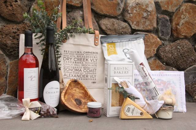 Wedding welcome bag overflowing with amazing Sonoma County wine, food, candy and gifts. The perfect wedding weekend welcome! By Favor.