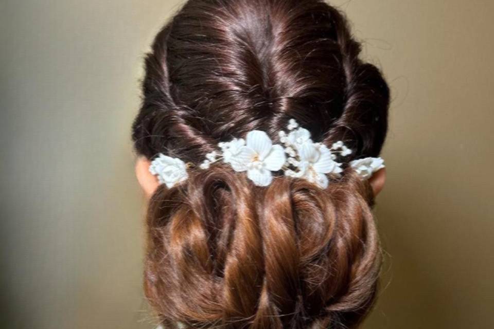 Romantic low bun with flowers