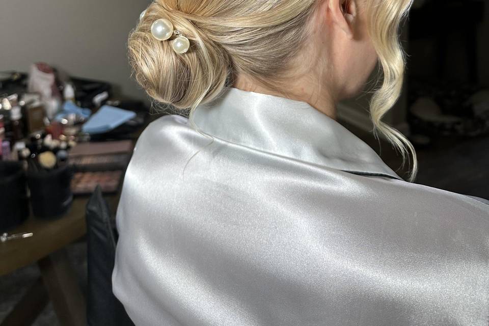 Elegant low bun with pearls
