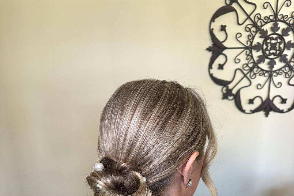 Elegant low bun with pearls