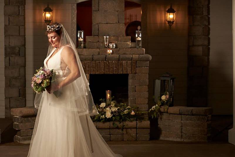 Bride by fireplace