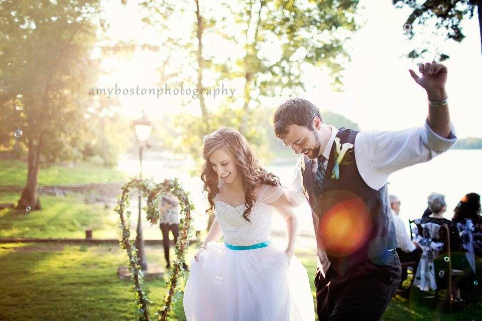 Bride and groom on back lawnphoto by Amy Boston Photography