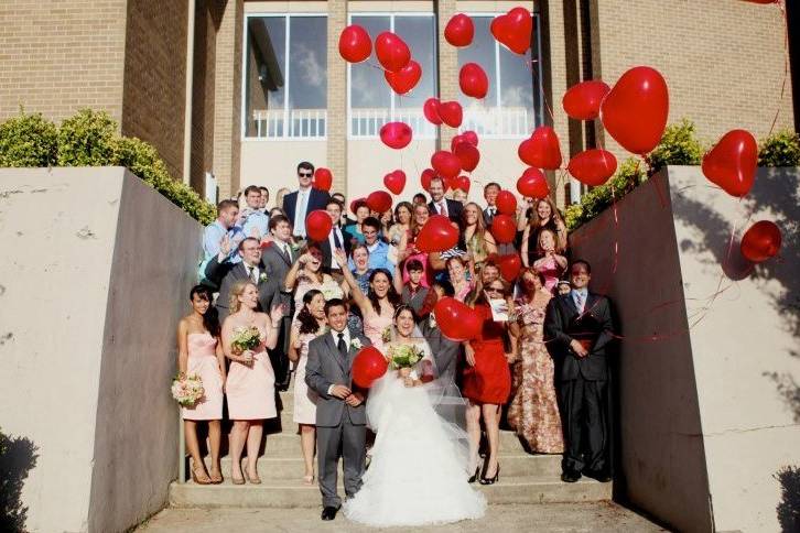 Wiedemann - Nguyen Wedding balloon release outside churchPhoto by Coco Photography