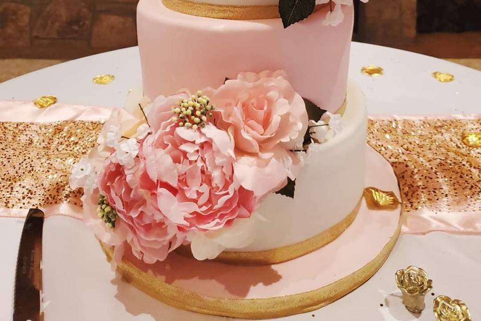 Pink and gold wedding cake