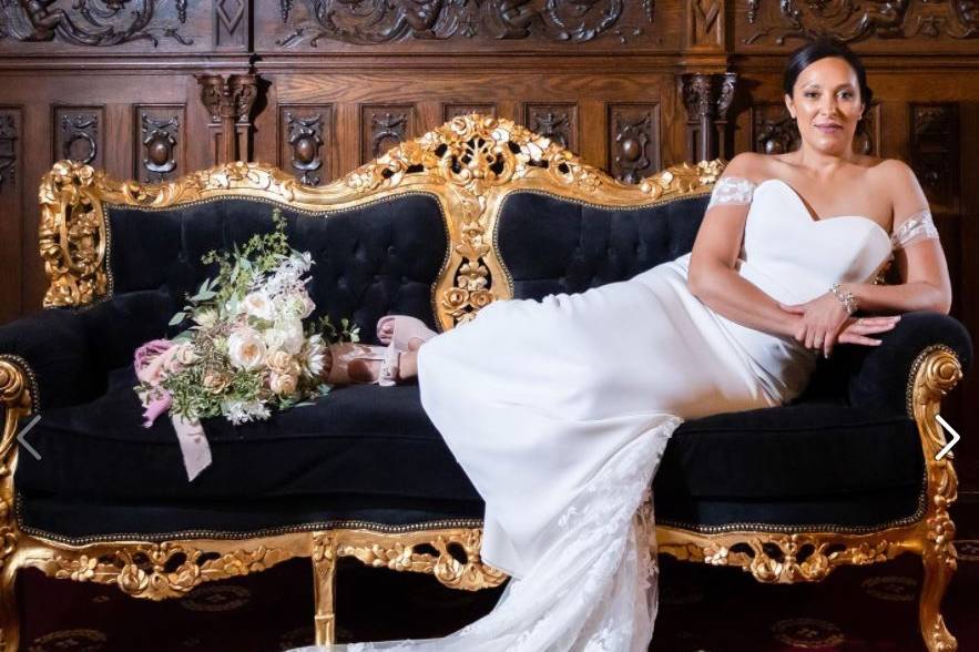 Bride on ornate couch