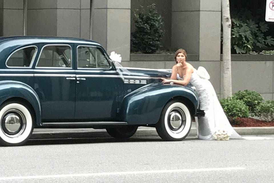 Bride and vintage car