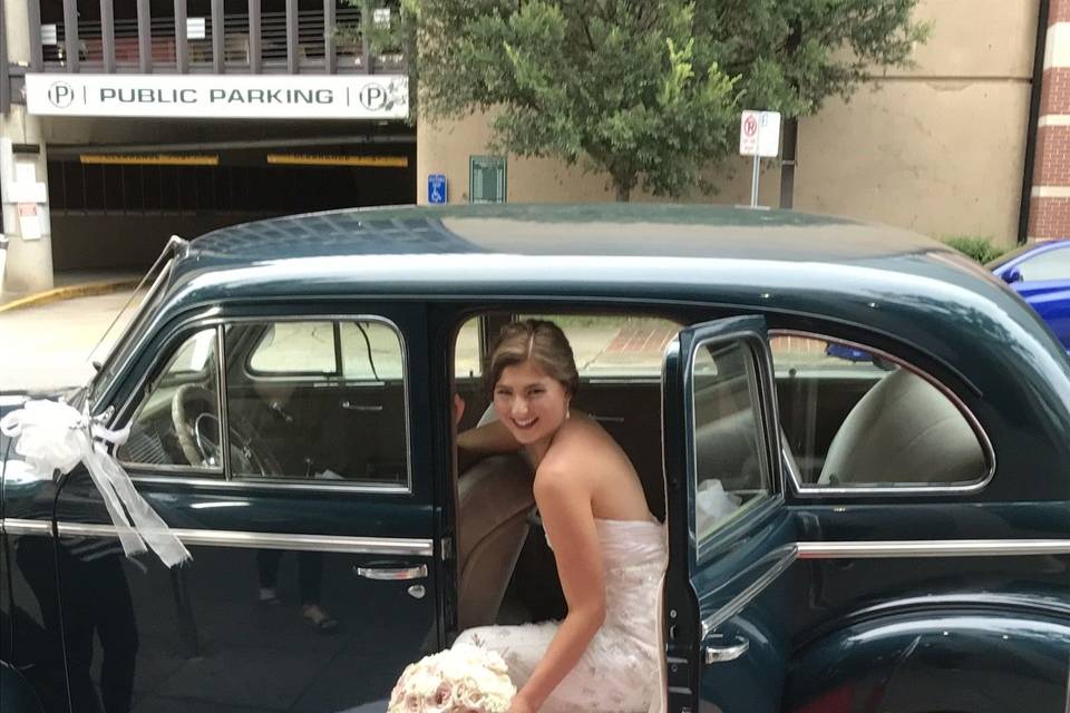 Bride and vintage car