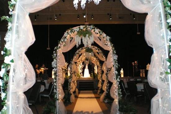 Dramatic entrances such as these lit archways, only add to the pomp and circunstance of the bride's big entrance.