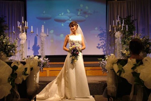 The periwinkle hughes in this bride's color pallet lent itself to a fabulous floating candle backdrop that set her ceremony apart from any other