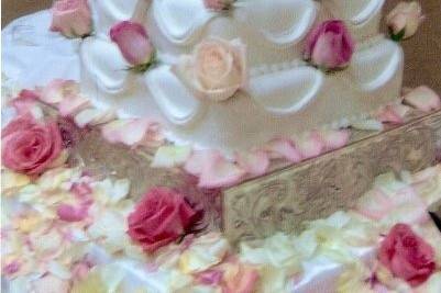 Fondant covered square stack tiers. Swags. Real roses