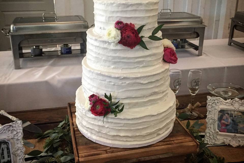 This 5-tier rustic buttercream beauty was all vanilla sponge, with a different flavor filling for each tier.