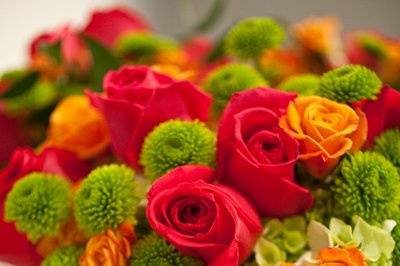 Orange and red themed floral arrangement
