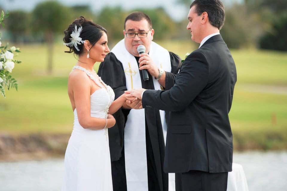 Groom and bride with the officiant