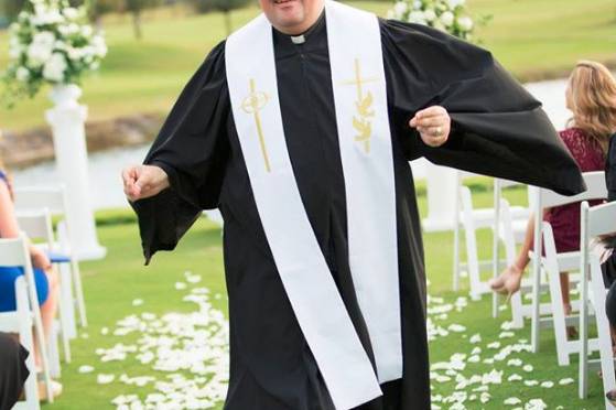 Minister walking down the aisle