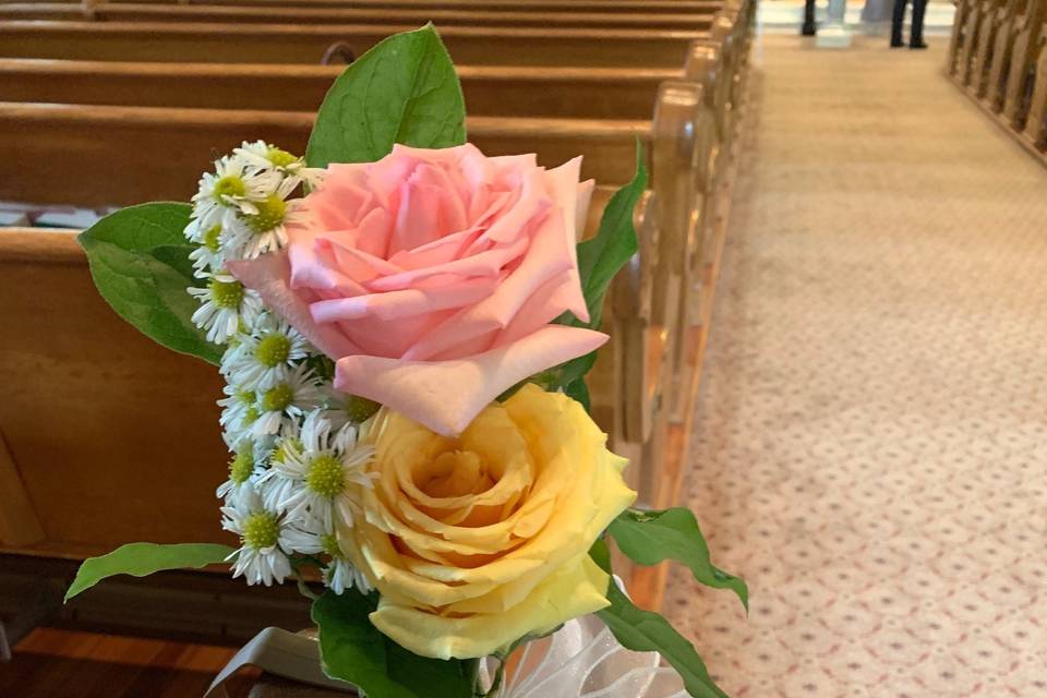 Roses to decorate a pew