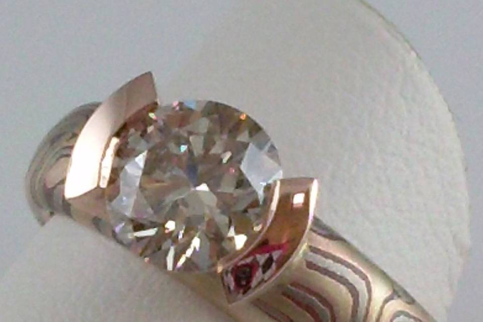 Mokume band with diamond engagement ring