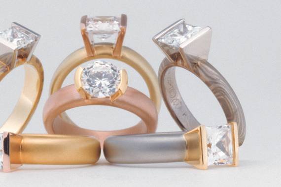 Solid and mokume patterned engagement rings