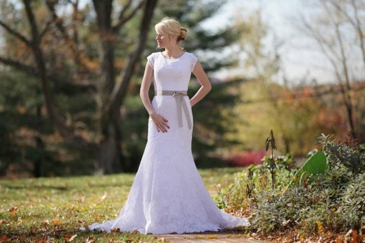 Riley Slim fitted sheath is sophisticated and lovely. Lace appliques bridal gown features an amazing scalloped lace edging at hem and satin ribbon at natural waist.
Belt is available in several colors.
(Shown here: White gown with silver belt)