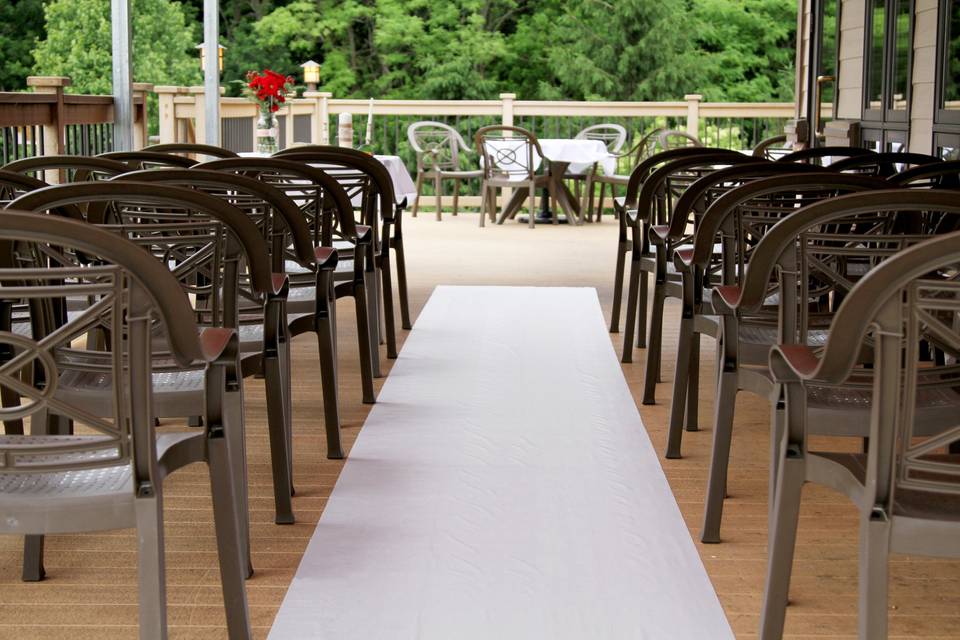 Ceremony area on raised deck overlooking golf course.