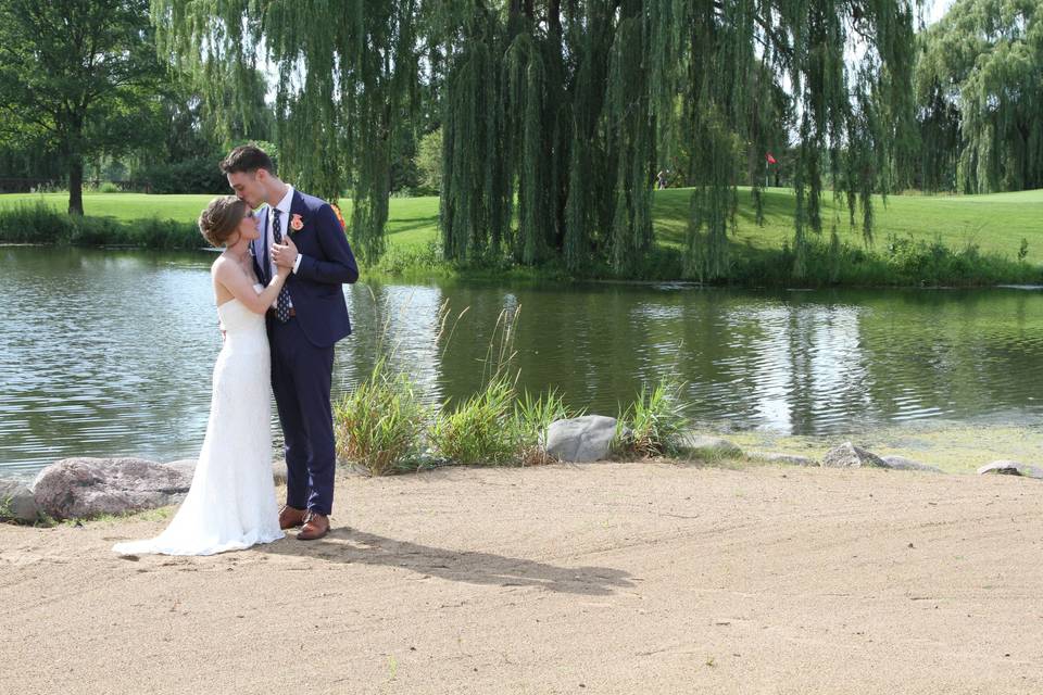 Bride and groom share a moment on the golf course