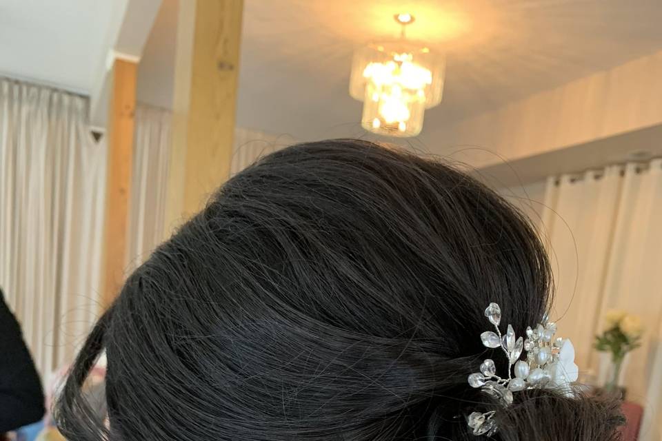 Low chignon bridal hair updo