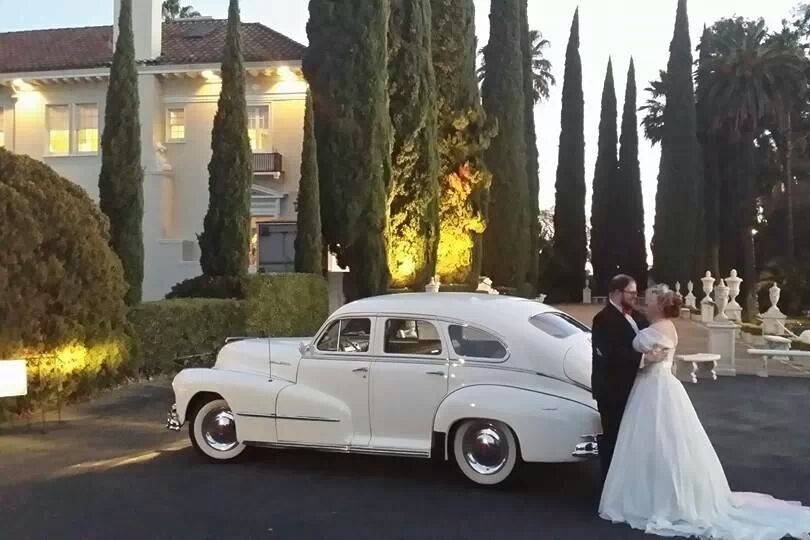 The couple besides a car