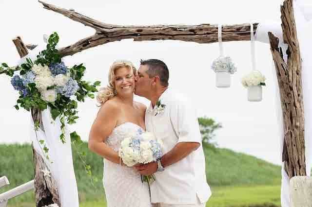 Groom kisses