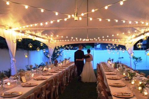 High peak frame tent with café streamer lighting. Beautiful and intimate wedding.