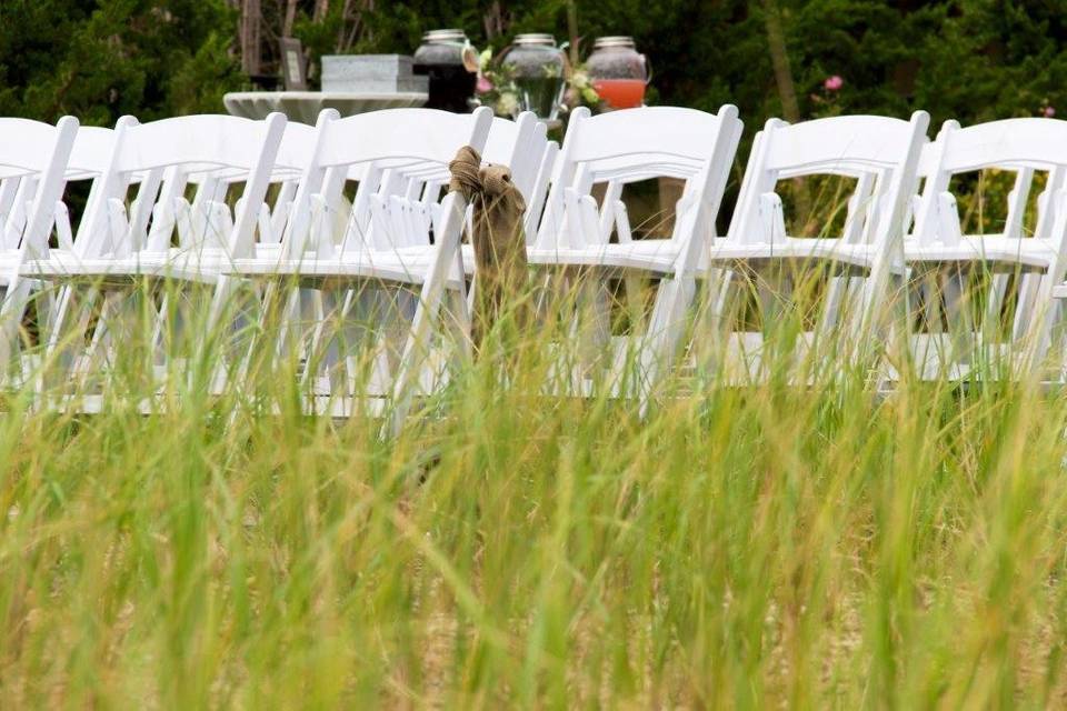 White resin ceremony chairs