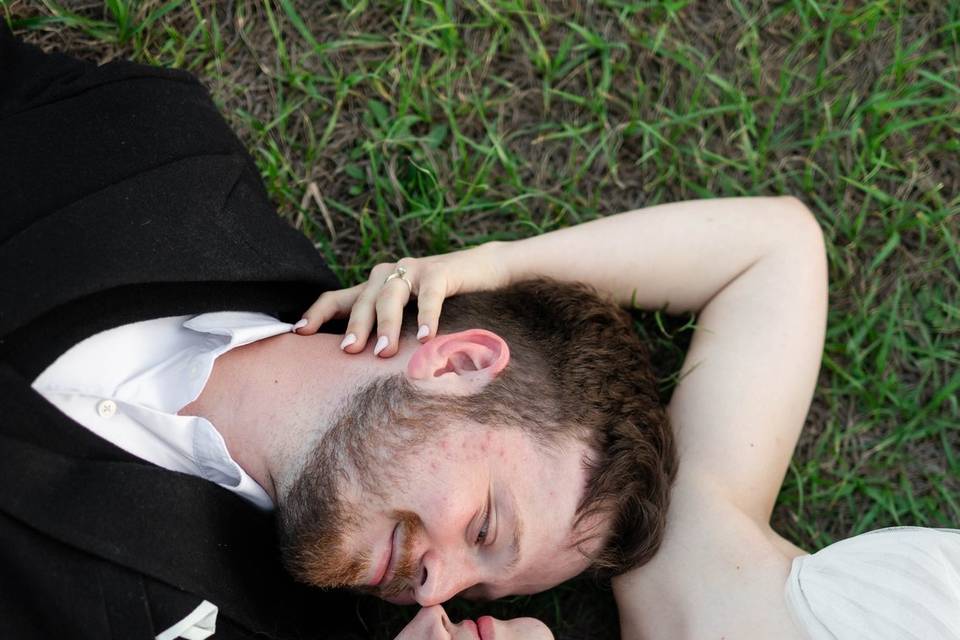 Bride and groom laying down