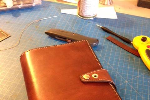 custom leather cover for the family's heirloom bible used in the wedding.