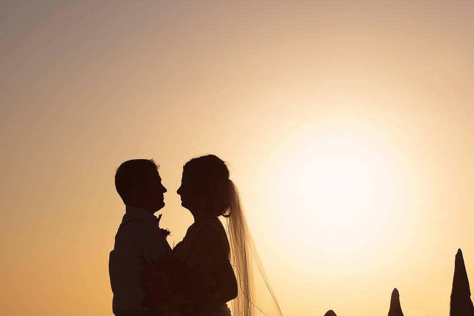 Exchanging vows beneath the sunset