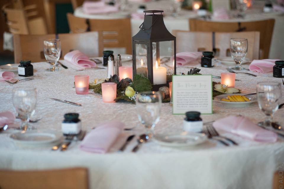 Round table setup with a touch of pink