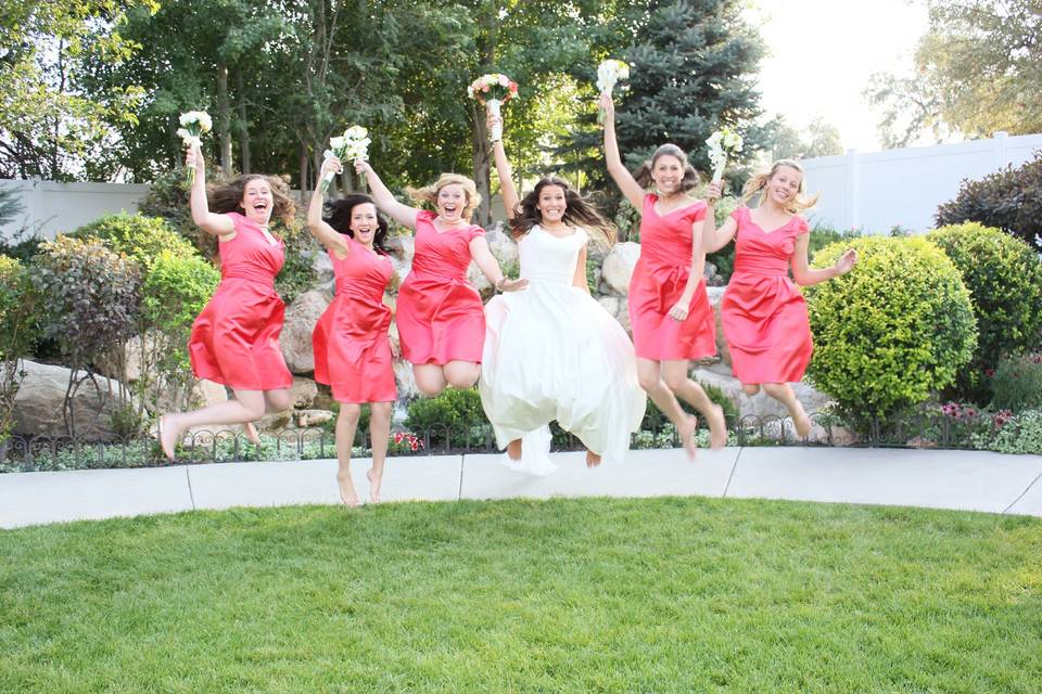 Jump shot of bridal party