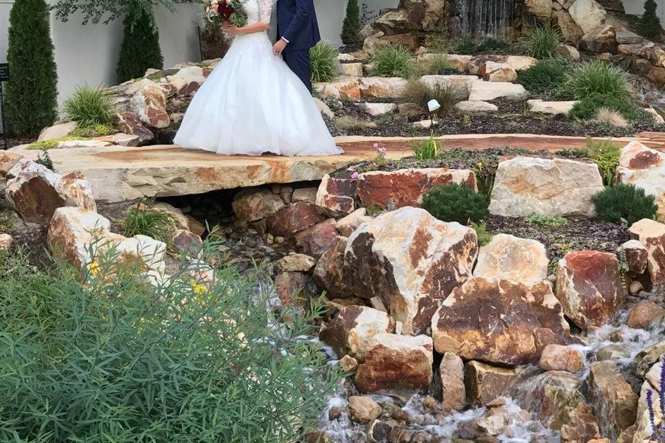 Newlyweds by the waterfall