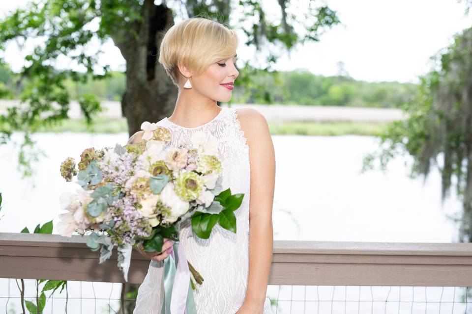 Bride poses with flowers