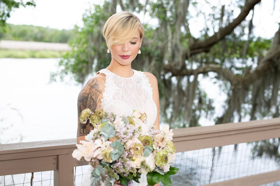 Bride poses with flowers