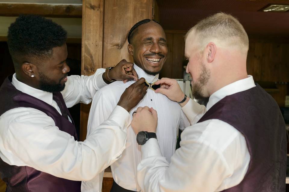 Groom getting help
