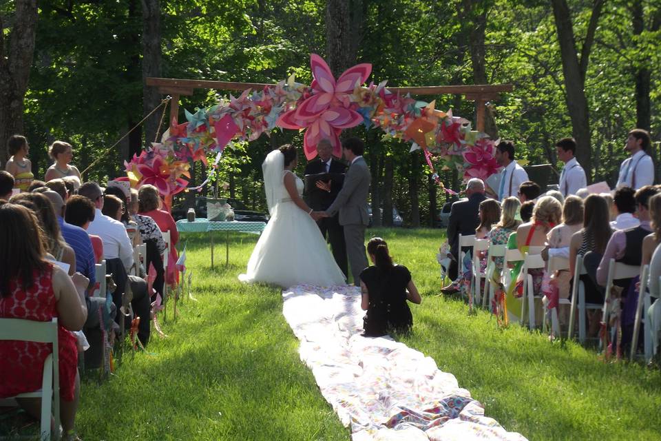 Ceremony in the meadow near the pavilion with a homemade arbor!