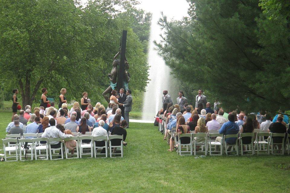 Ceremony in the meadow near the pavilion with a homemade arbor!