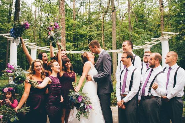 The couple with the bridesmaids and groomsmen