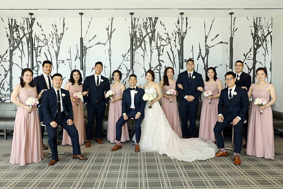 The couple with bridesmaids and groomsmen