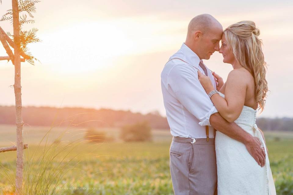 Newlywed couple in the field