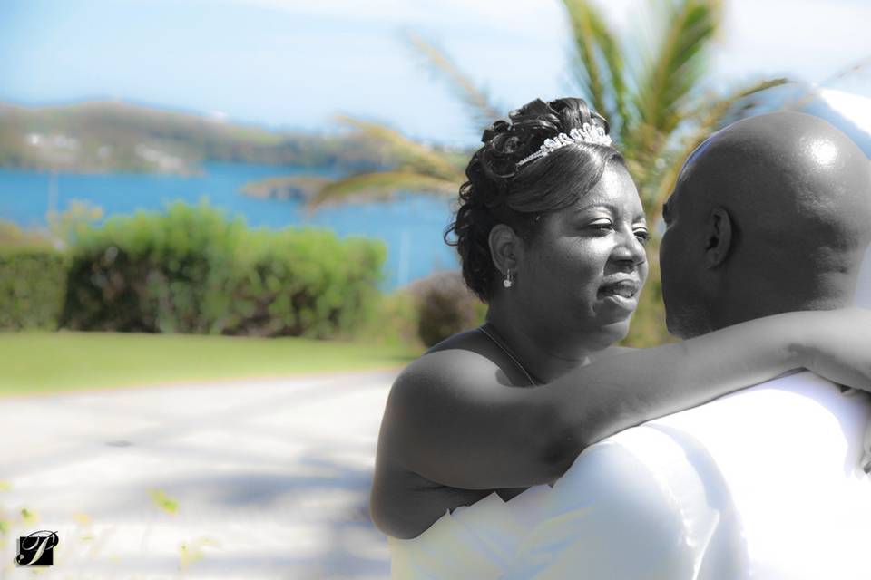 Newlyweds walk by the shore