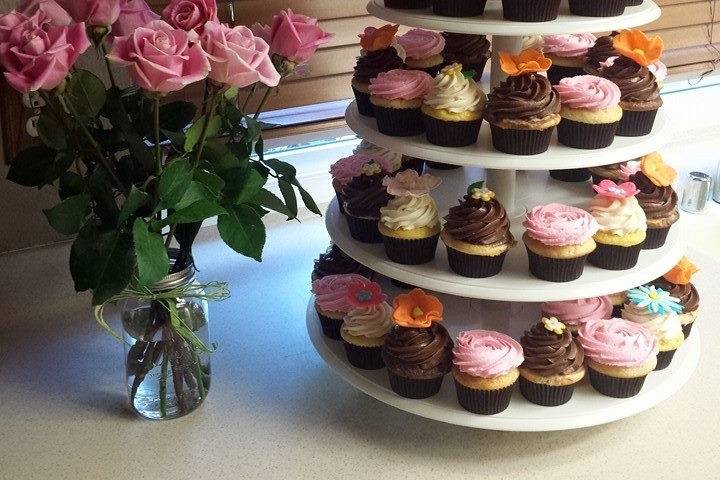 Fondant flowers topped these cupcakes with rosette cake ontop