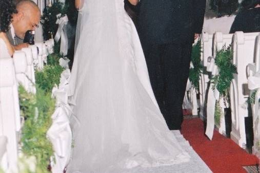 Father and bride walking down aisle